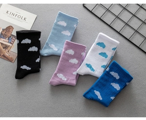 Cute cloud pattern cotton crew socks detail shot showing various colorful casual skateboarding socks.