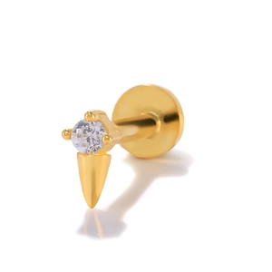 Macro view of gold S925 silver piercing stud featuring a clear crystal and cone tip detail