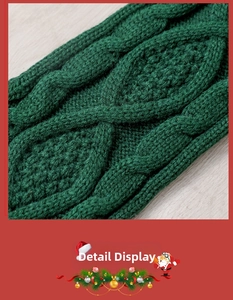 Detailed macro view of the forest green cable knit texture on a 46cm Christmas stocking