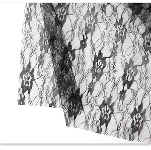 Close-up of black floral lace fabric with intricate mesh patterns for scary ghost masks
