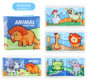 Macro detail of animal cognition soft baby book with vibrant dinosaur and giraffe prints