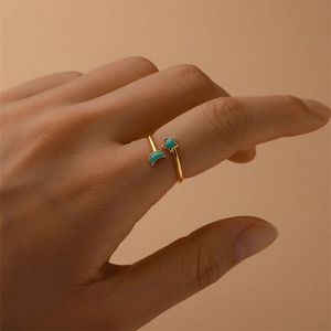 Detail of s925 silver triple cross ring with moon star motifs and green inlay