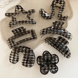 Set of 7 acrylic hair claws with black and white gingham pattern in stars and flowers