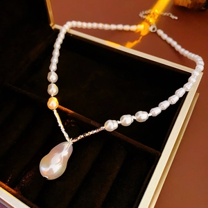 Vintage baroque pearl necklace with irregular silver accents and drop pendant in a box