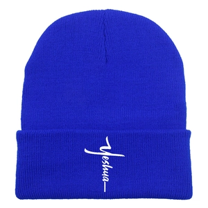 Detail view of royal blue knit beanie with white Yeshua cross embroidery on the cuff