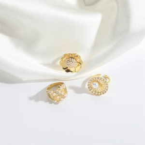 Three elegant gold flower open rings set with ABS pearls and sparkling crystals