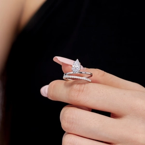 Double-layered S925 sterling silver ring featuring a pear-cut cubic zirconia stone
