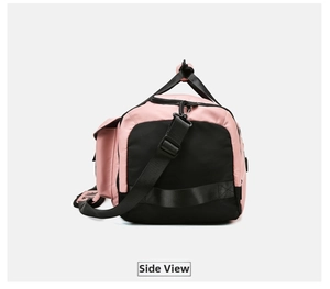 Side view of pink and black travel gym bag with adjustable lettered shoulder strap