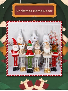 Detail of Christmas plush figures featuring sequins and snowflake embroidery details