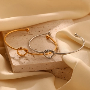Polished titanium steel knot open cuff bracelets in gold and silver finish for women