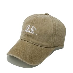 Close-up of khaki washed cotton baseball cap featuring detailed puppy embroidery design