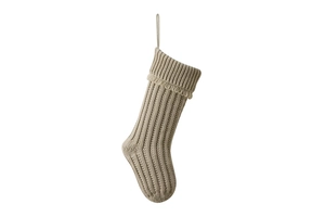 Detail of cream knitted Christmas stocking featuring vertical stripes and fringe tassels
