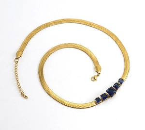 Detailed view of 18k gold plated snake chain necklace with five square blue zircons