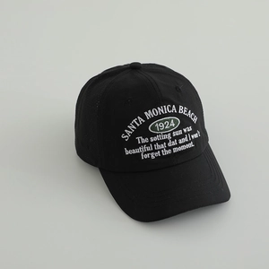 Detailed view of Santa Monica Beach 1924 embroidery on black cotton baseball cap