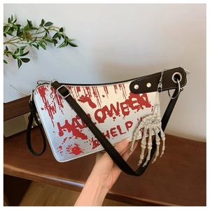 Detail of silver cleaver bag with red blood print and skull hand charm for Halloween