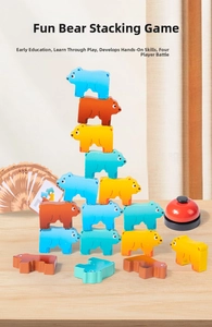 Macro detail of wooden bear stacking blocks with a call bell and challenge cards