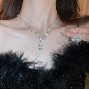 Elegant silver teardrop zircon jewelry set with necklace and earrings worn by model