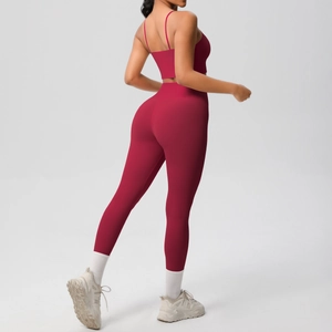 Detail view of burgundy yoga set featuring backless sports bra and high-waist leggings