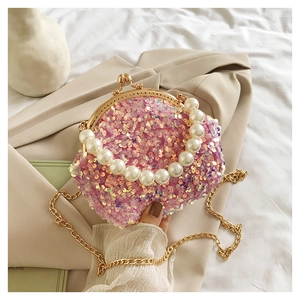 Pink sequin mini shell bag featuring pearl bead handle and gold metal chain strap
