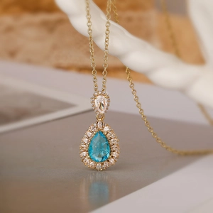 18K gold plated teardrop necklace with light blue stone and double layer zircon halo