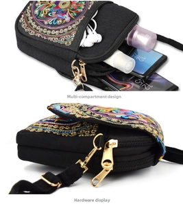 Detail of ethnic canvas crossbody bag with multi-layer zipper and mandala embroidery
