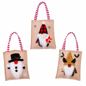 Three linen Christmas gift bags with plush gnome designs and red striped handles