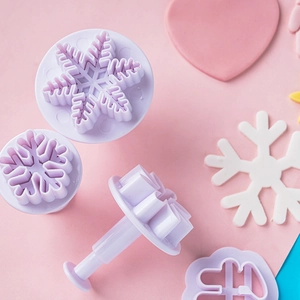 Light purple plastic snowflake fondant plunger cutters set for holiday cake decorating