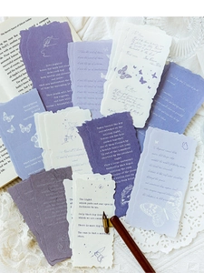 Detailed view of vintage purple aesthetic scrapbooking paper with poetic text and frayed edges