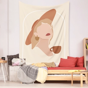 Detail showing a bohemian faceless art tapestry hanging on a warm cozy bedroom wall
