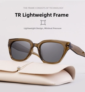 Detail of amber TR frame sunglasses with polarized lenses and a cream leather case