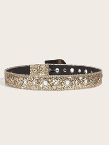 Close-up of golden glitter belt featuring double row silver eyelets and metal buckle