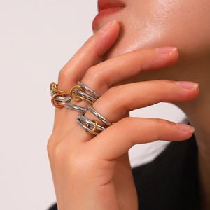 Three-tone interlaced stainless steel rings in gold silver and rose gold finishes