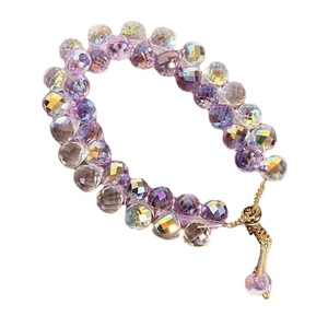 Iridescent purple faceted crystal bracelet with adjustable gold chain and bead tassel