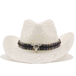 Close-up of white woven straw cowboy hat featuring a tribal band and metallic bull skull
