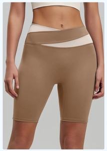 Detail view of high waist V-shaped crossover waistband on contrast fitness shorts