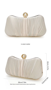 Detailed view of cream clutch bag with pleated fabric and pearl clasp showing dimensions