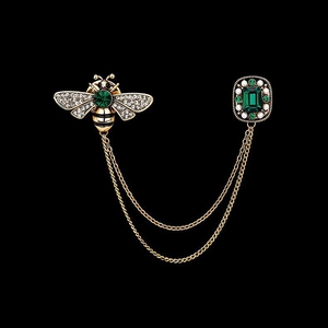 Vintage golden bee brooch with green emerald gems, pearl accents and tassel chain