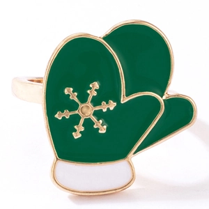 Detailed view of green enamel Christmas glove ring with golden snowflake pattern