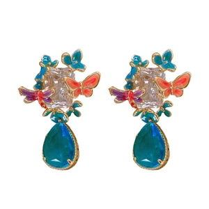 Vintage gold butterfly drop earrings with colorful enamel and zircon crystals on white background