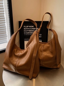 Minimalist brown soft leather tote bag for women with adjustable shoulder strap