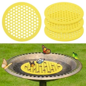 Macro shot of yellow round plastic mesh filters for bird bath used in garden scenarios