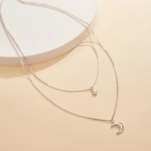 Detail view of S925 silver double layer necklace with star and moon zircon pendants