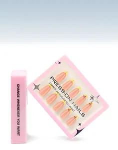 Detail of 30-piece press-on nail kit featuring yellow French tips and cherry designs