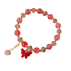 Elegant beaded bracelet with red faux jade, orange crystals and butterfly pendant charm