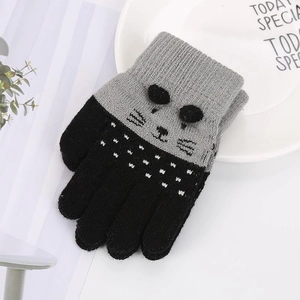 Detail of winter knit gloves for kids with cat ears and non-slip palm grip texture
