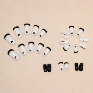 Square medium press-on nails featuring black and white love heart and French tips