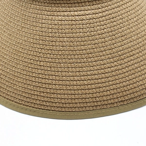 Foldable summer straw sun hat with detailed woven texture and wide brim for UV protection