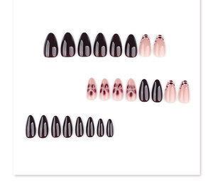 Detailed view of 3D almond press-on nails featuring floral and leopard print patterns