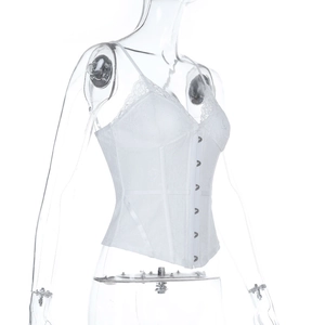 Detail of white floral lace camisole showing intricate fabric texture and front metal hooks