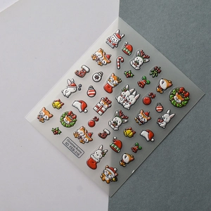 5D embossed Christmas nail stickers featuring cute cartoon bunnies and festive fox designs